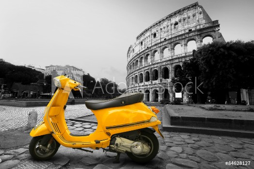 Picture of Yellow vintage scooter on the background of Coliseum